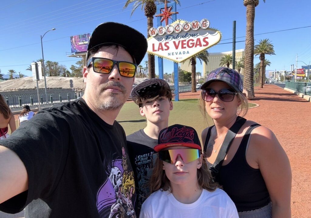 Double Down Mac and his family at the Welcome to Fabulous Las Vegas sign.
