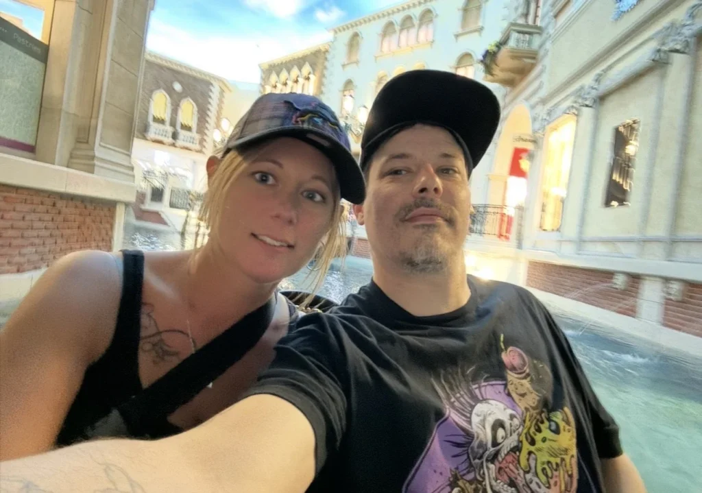 Double Down Mac and Nikki taking a selfie along the indoor Grand Canal at The Venetian Resort in Las Vegas.