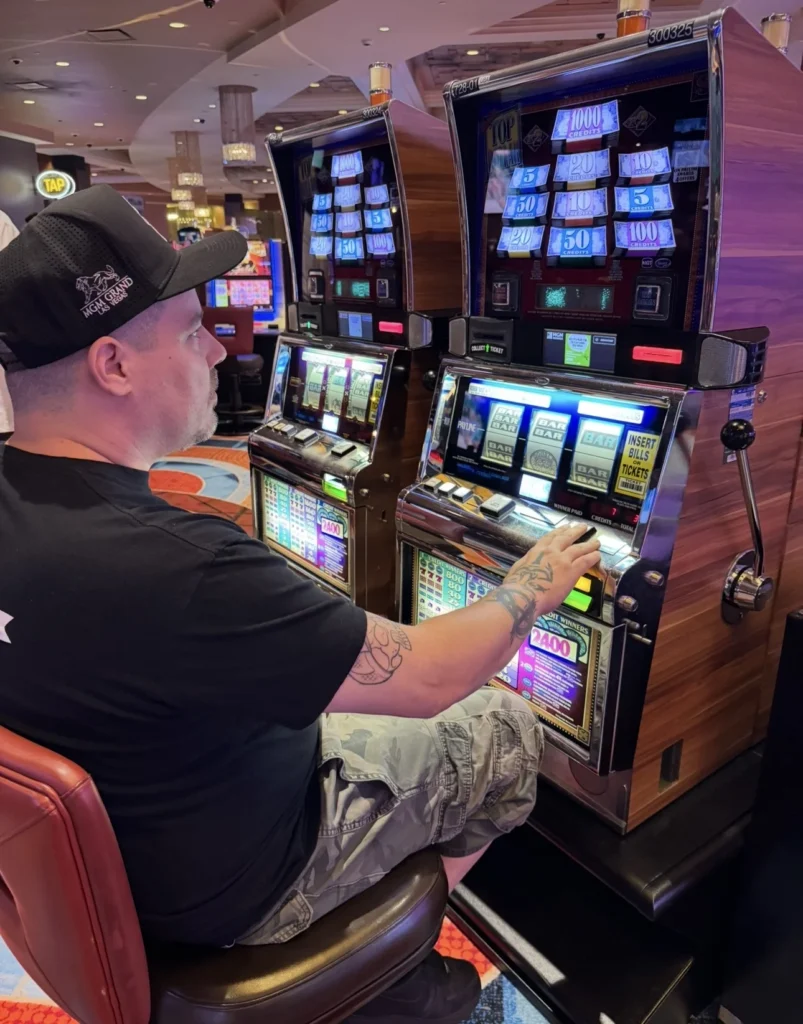 Double Down Mac playing a Top Dollar slot machine at MGM Grand Detroit.