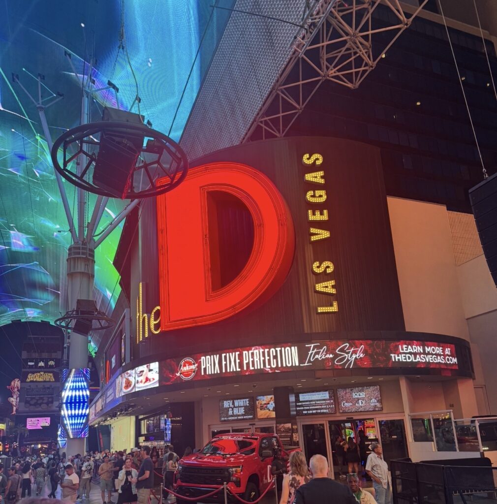 The D Las Vegas casino entrance illuminated at night on Fremont Street in downtown Las Vegas
