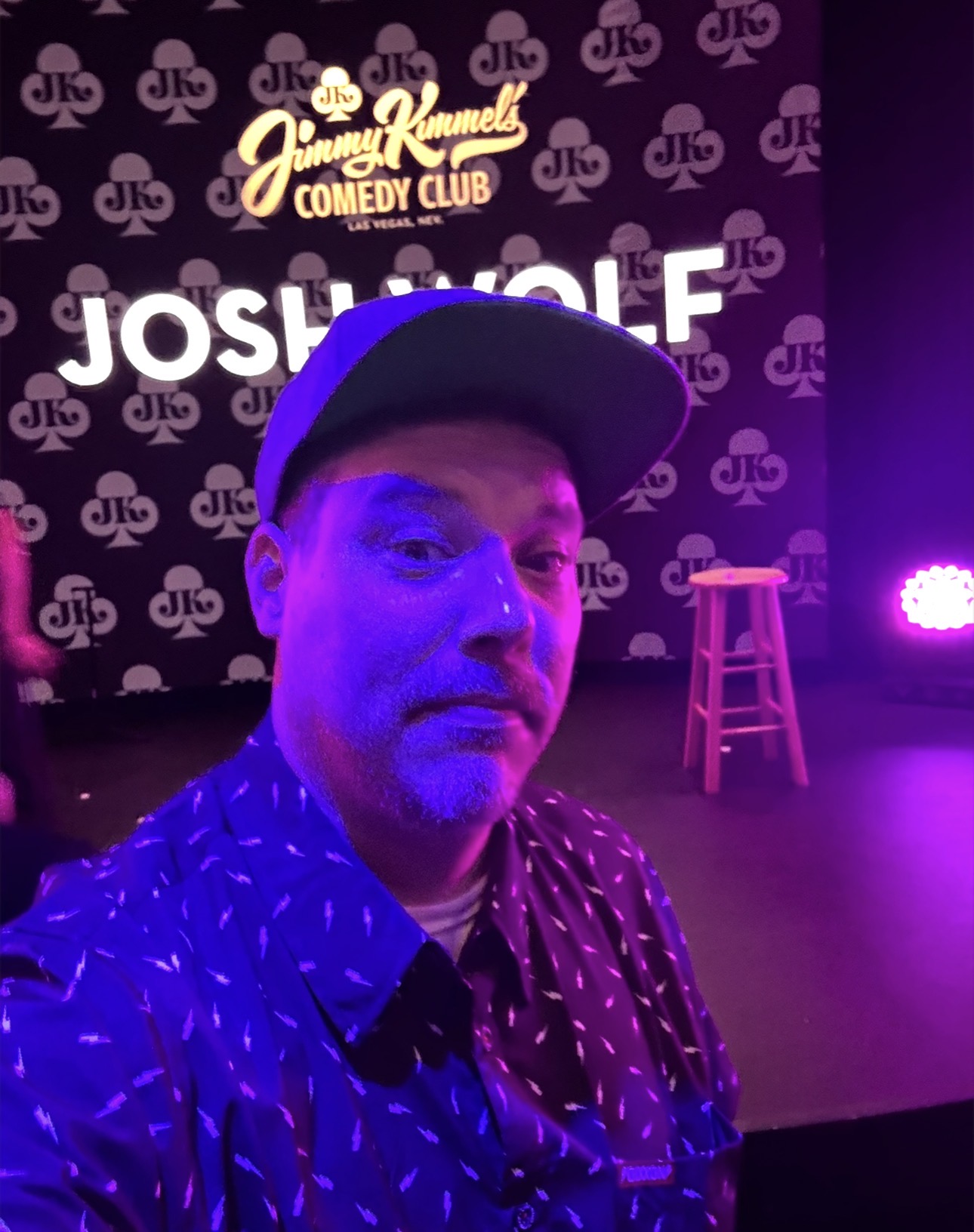 Guest taking a selfie near the stage at Jimmy Kimmel’s Comedy Club Las Vegas