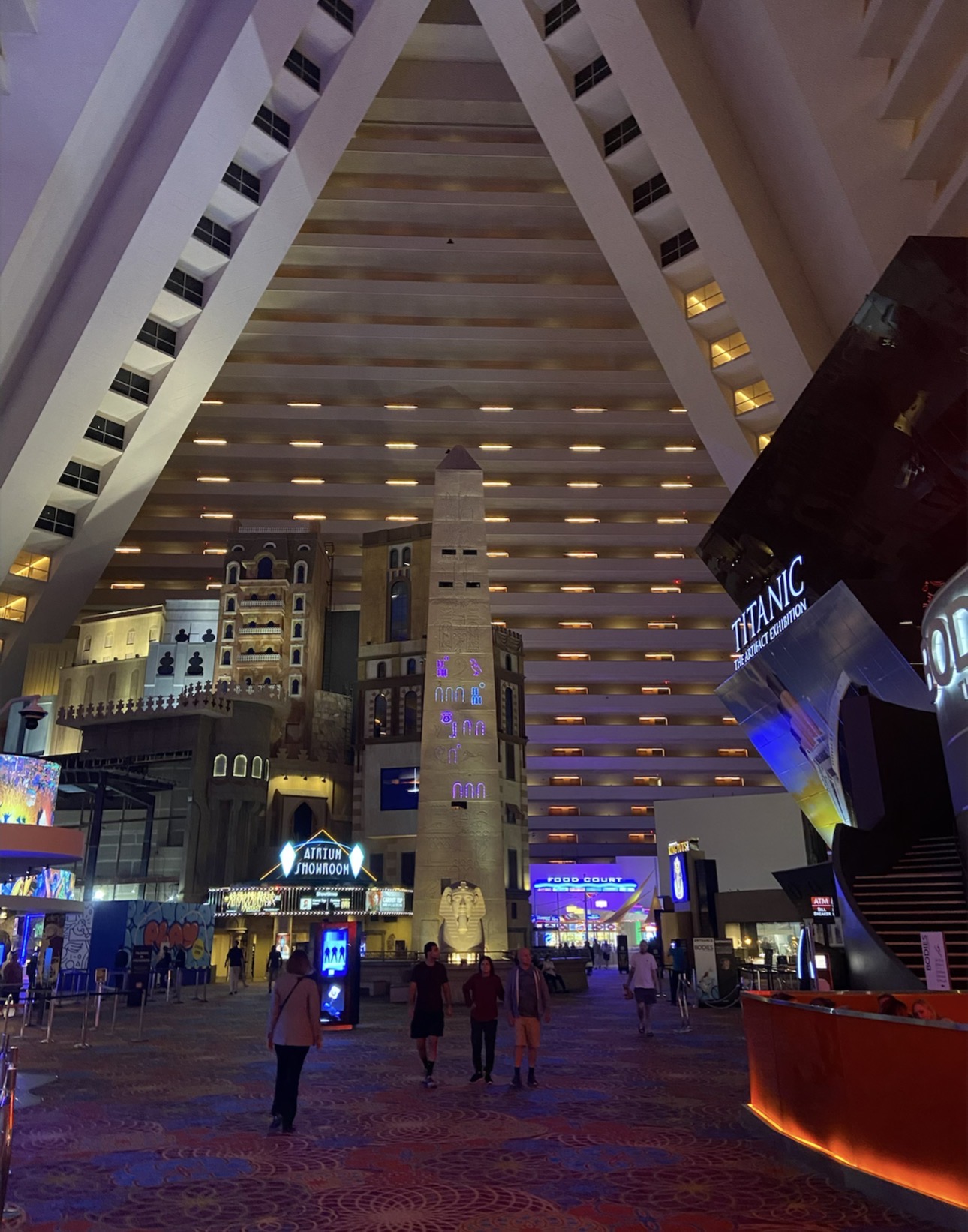 Huge interior atrium inside the Luxor Las Vegas pyramid with hotel rooms rising along the walls