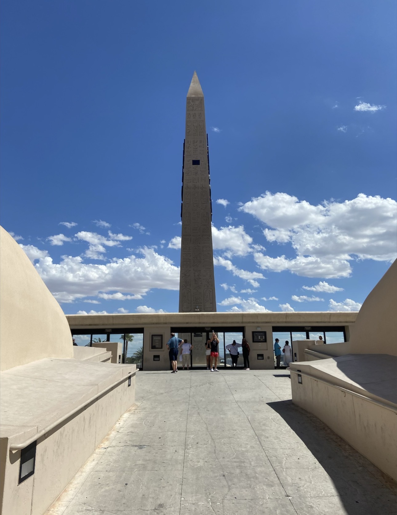 Egyptian-style obelisk outside Luxor Las Vegas beneath a bright blue sky