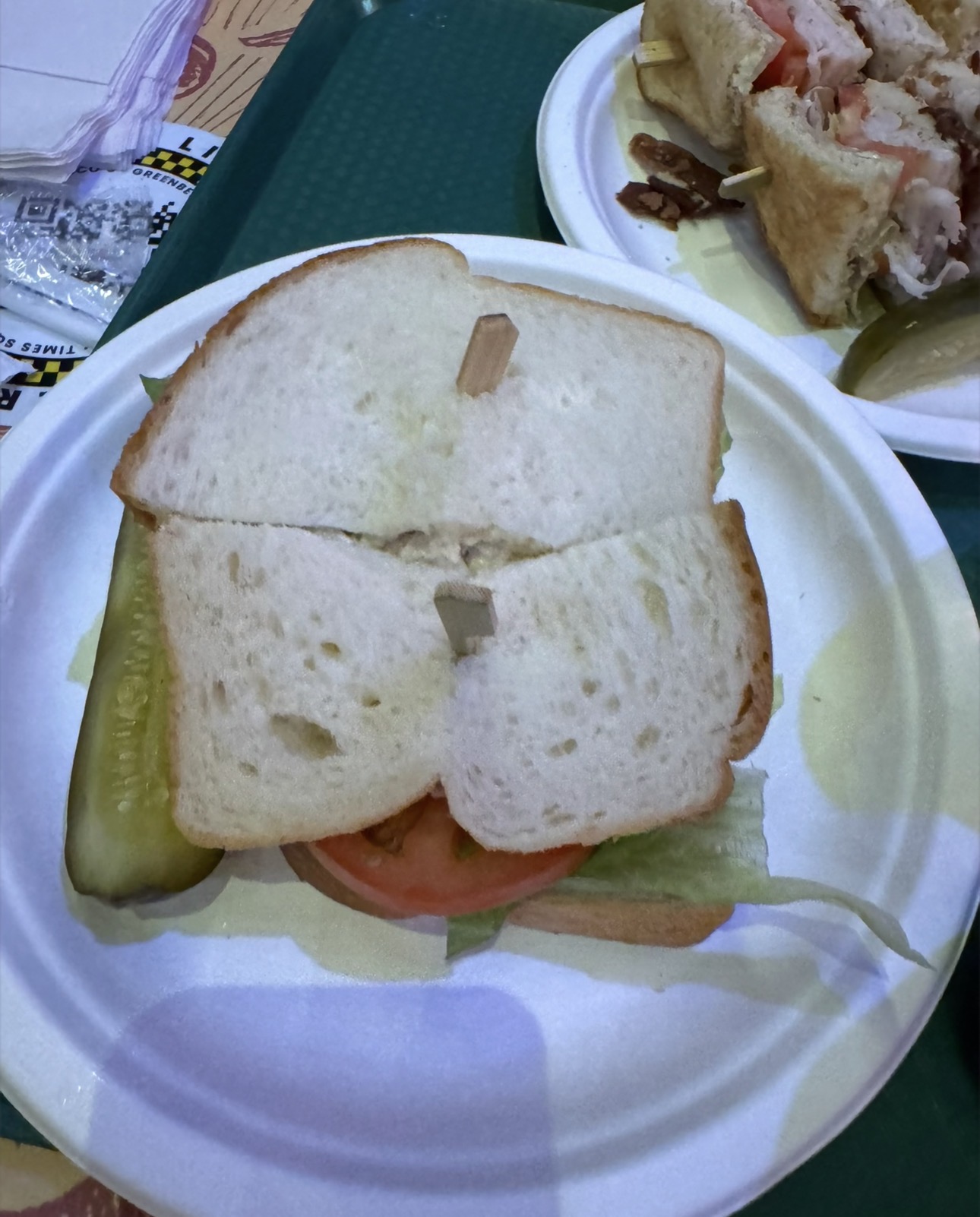 Turkey sandwich and pickle served at Greenberg’s Deli inside New York-New York